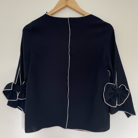 Cute navy long sleeve top with white details and bows on the sleeve from Zara - Picture 4 of 4